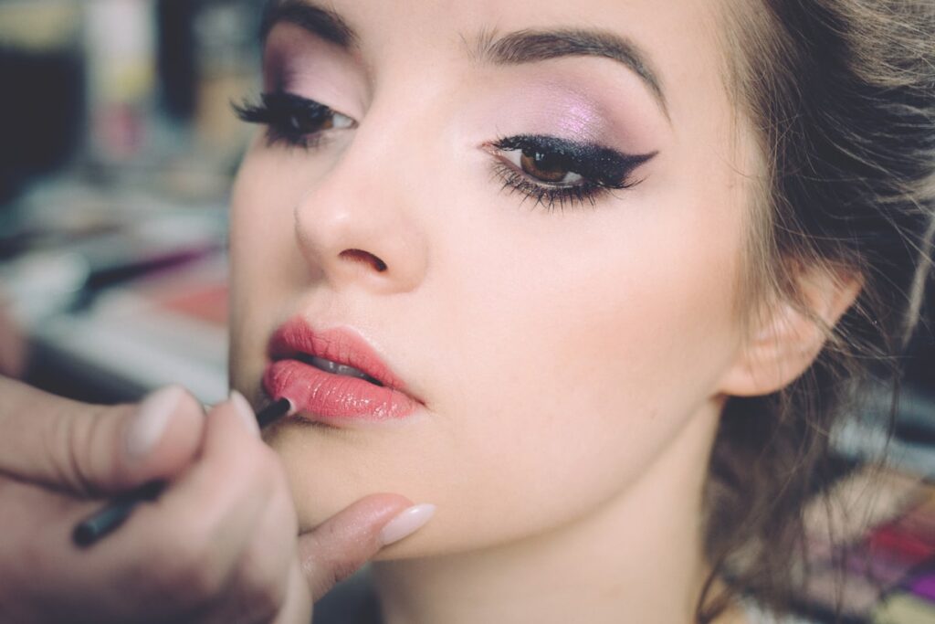 Makeup artist applying professional makeup at The Beauty Loft salon in Bucharest